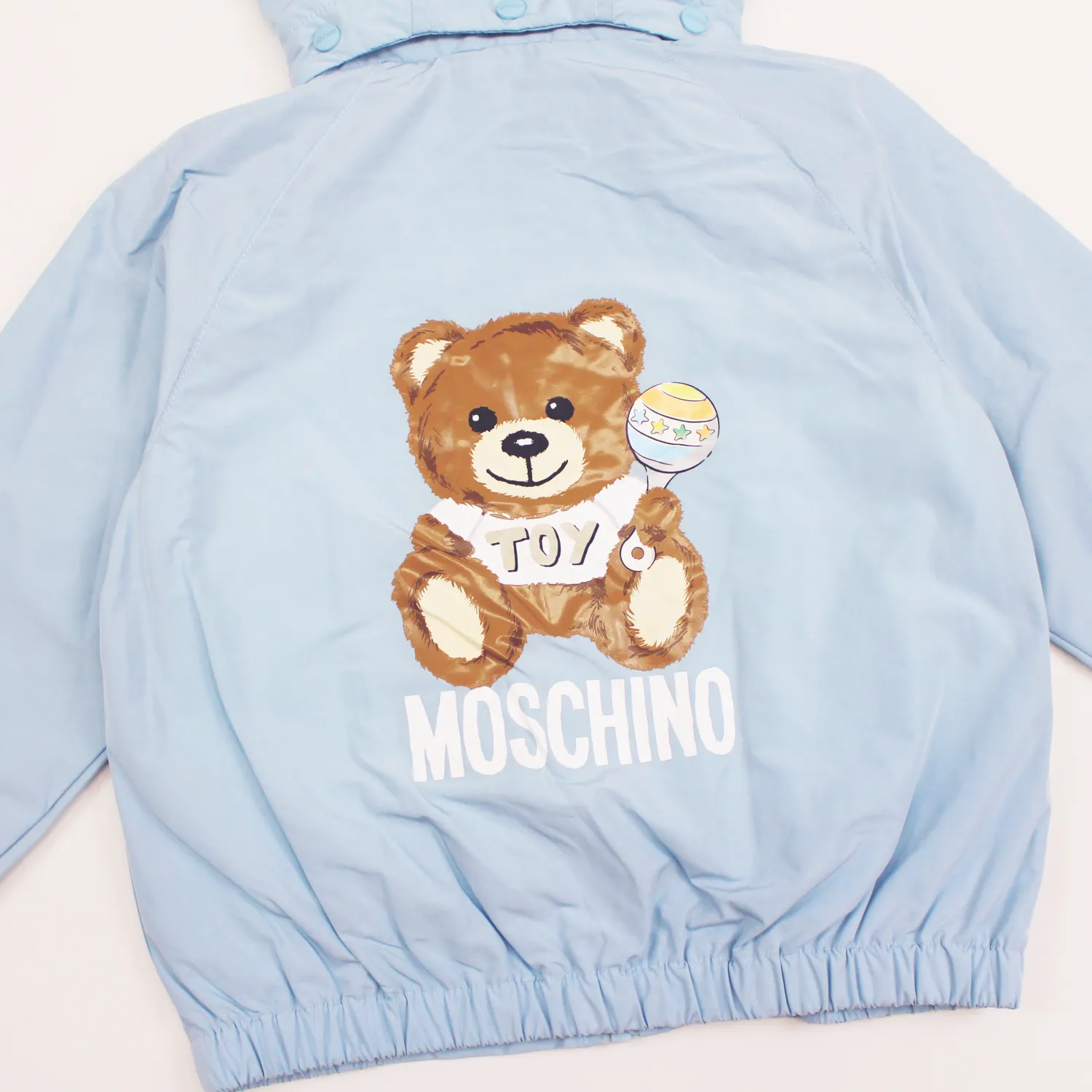 Moschino Jackets> Baby Bear Toy Rattle Hooded Jacket Baby Blue